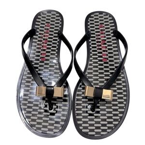Coach Landon Jelly Flip Flops. Signature gold‎ bow at top.  Size 6